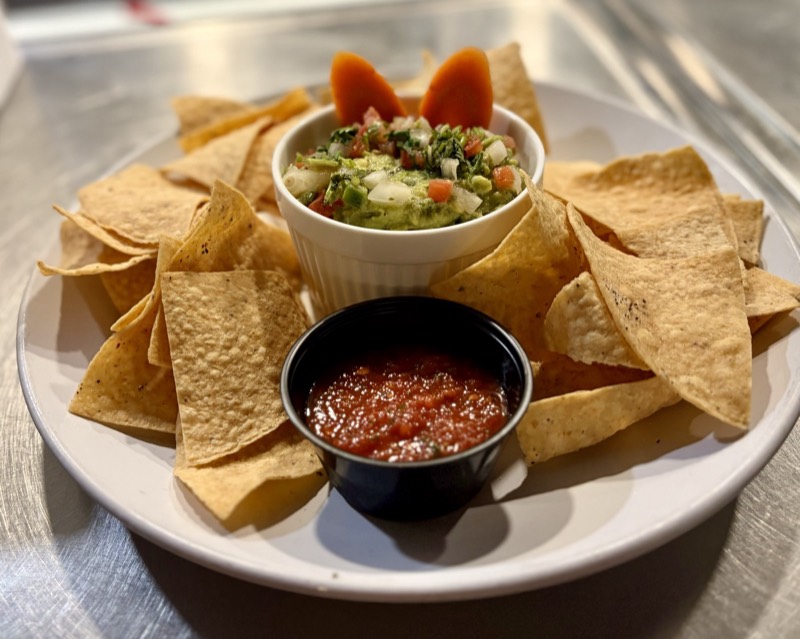 Tortilla chips with fresh guacamole and salsa